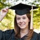 Photo of a woman wearing a mortarboard.