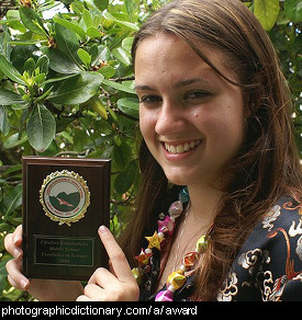 Photo of a girl holding an award
