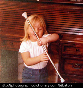 Girl holding baton