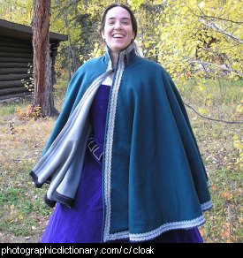 Photo of a woman wearing a cloak.