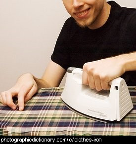 Photo of a man ironing clothes