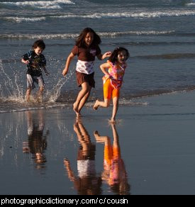 Photo of three cousins on the beach.