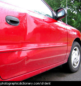 Photo of a car with a dent in the side