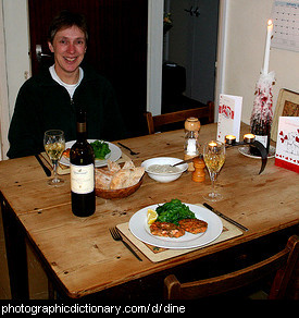 Photo of a man having dinner
