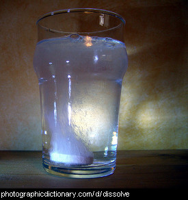 Photo of a tablet dissolving in a glass of water