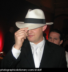 Photo of a man doffing his hat