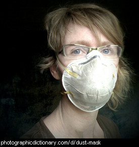 Photo of a woman wearing a dust mask.