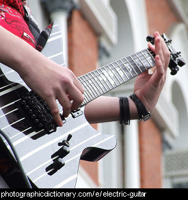 Photo of someone playing an electric guitar