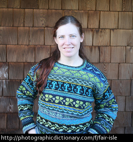 A woman wearing a fair isle sweater.