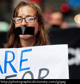 A protester wearing a gag.