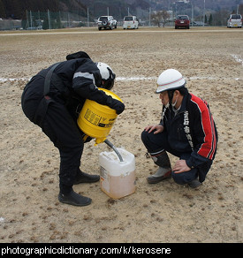 Photo of a man pouring kerosene