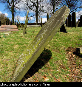 Photo of a leaning gravestone