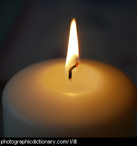 Photo of a lit candle