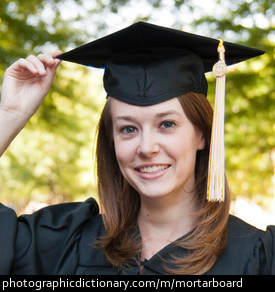Photo of a woman wearing a mortarboard.