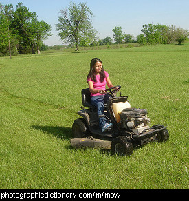 Photo of someone mowing a lawn