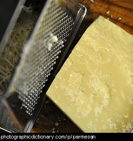Photo of parmesan cheese being grated.
