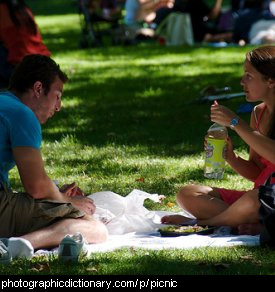 Photo of two people having a picnic