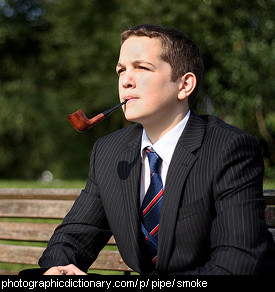 Photo of a young man smoking a pipe