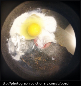 An egg being poached.