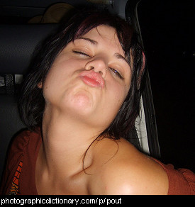 Photo of a young woman pouting