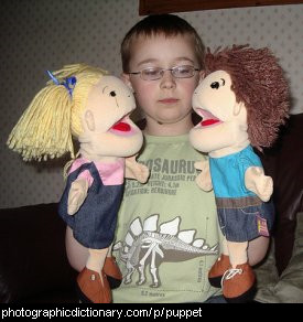 Photo of a boy with puppets