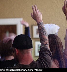 Photo of people with raised hands