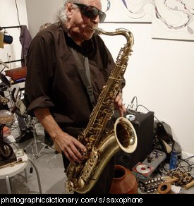 Photo of a man playing a saxophone
