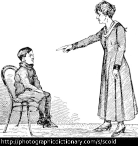 A woman scolding a boy. 
