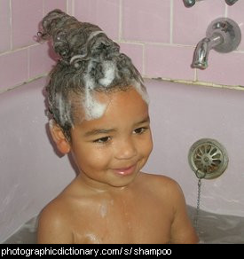 Photo of a child with shampoo in their hair