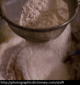 Sifting flour.