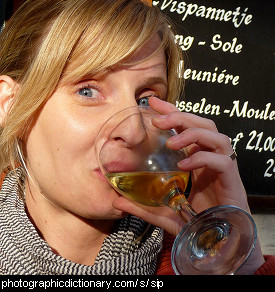 Photo of a lady sipping wine