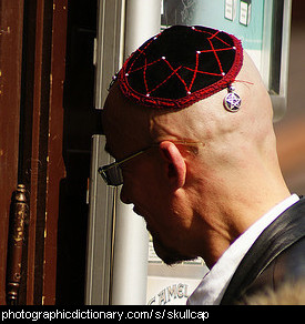 Photo of a man wearing a skullcap