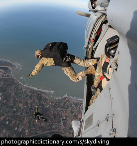 Photo of a man jumping out of a plane