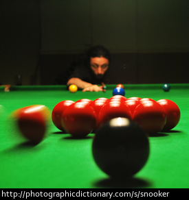 A man playing snooker.