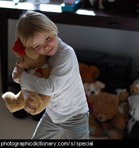 Photo of a girl and her special teddy