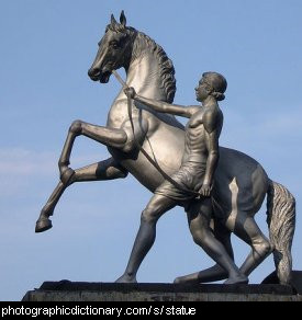 Photo of a statue of a man and a horse