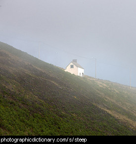 Photo of a house on a steep hill