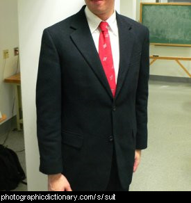 Photo of a man wearing a suit.