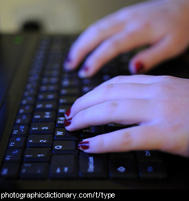 Photo of hands on a keyboard typing.