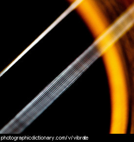 Photo of a vibrating guitar string
