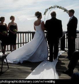 Photo of two people getting married.