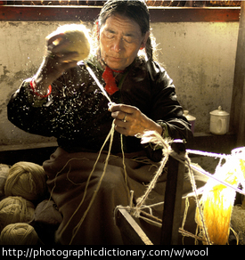 Photo of a man spinning wool