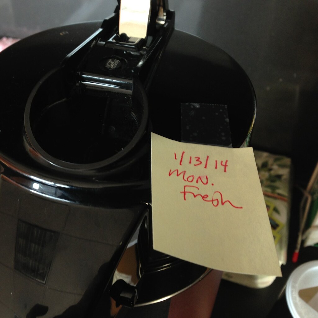 Photo of a post-it note stuck to a coffee machine