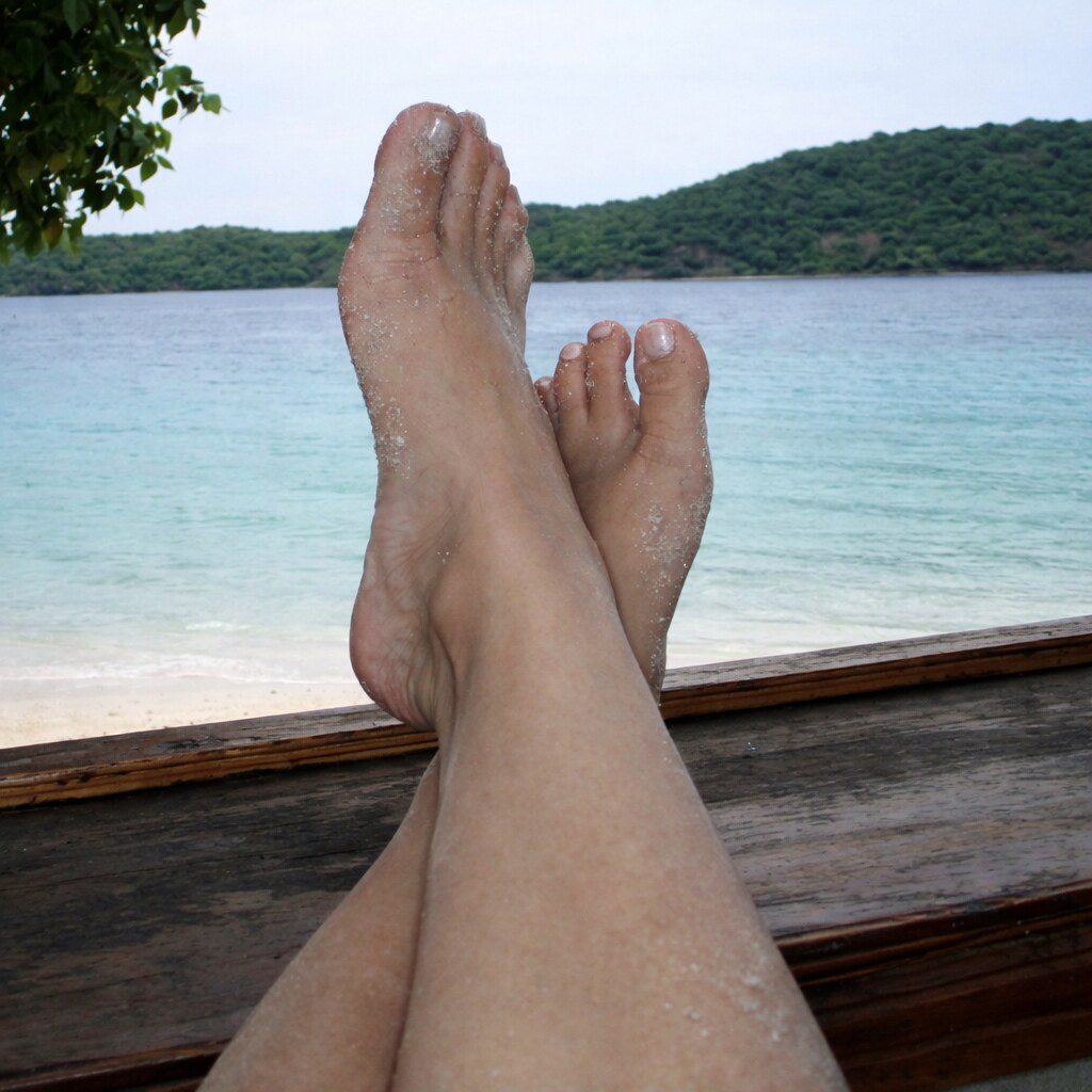 Photo of someone with their ankles up.