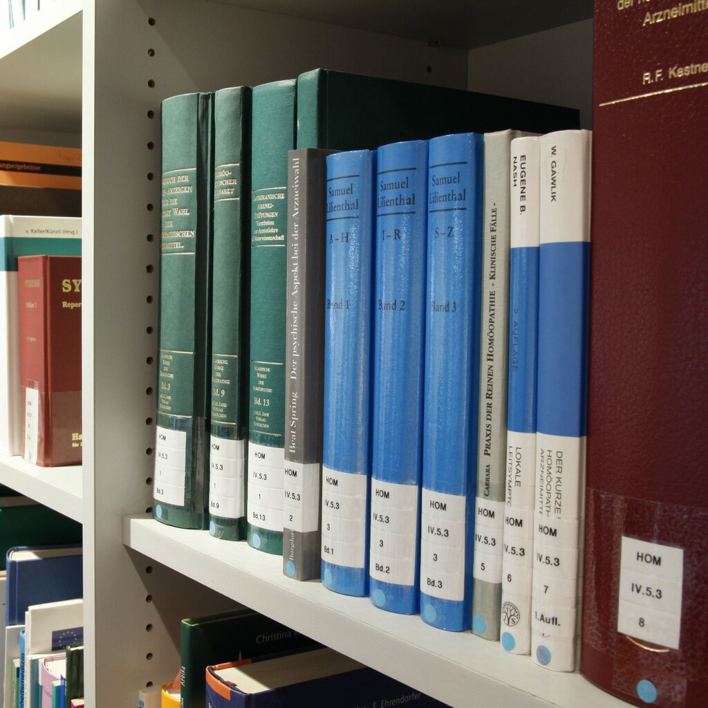 A photo of neatly arranged reference books on library shelves