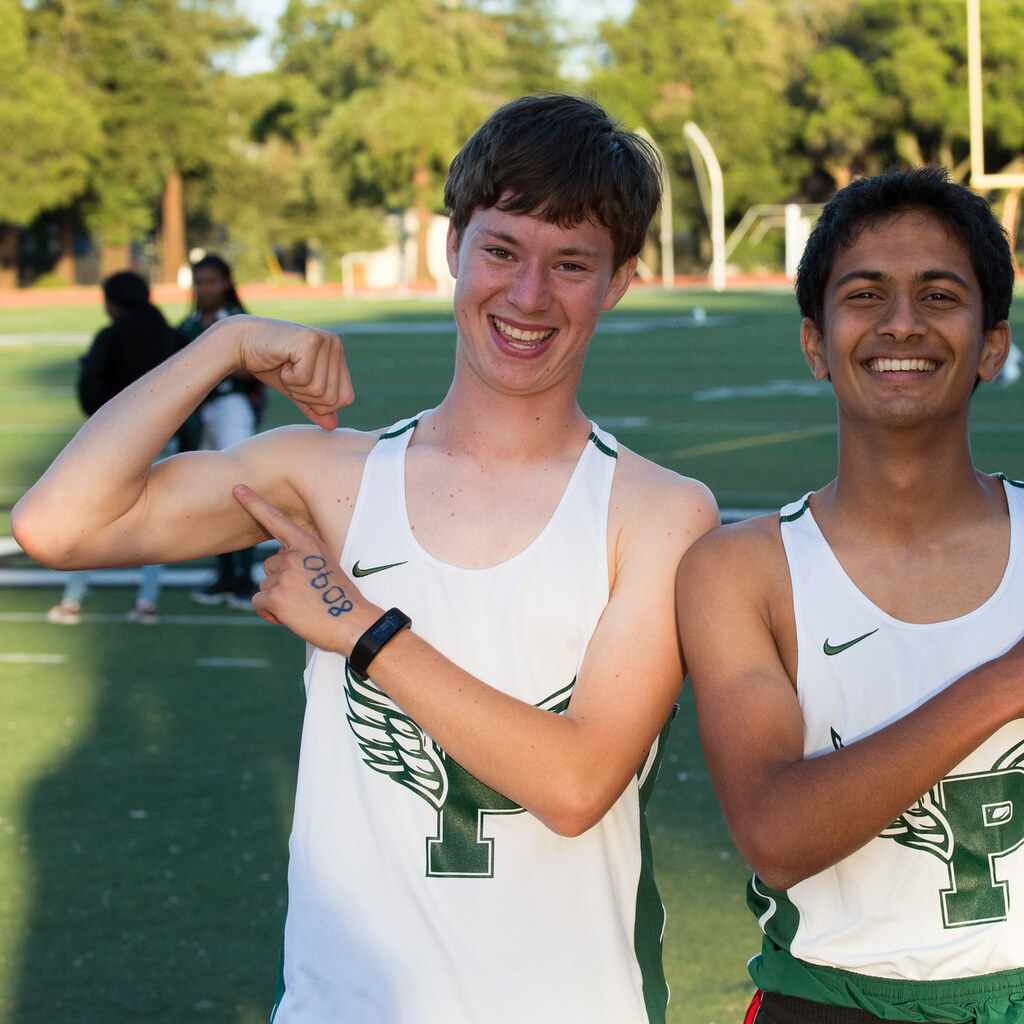 Photo of people pointing to biceps