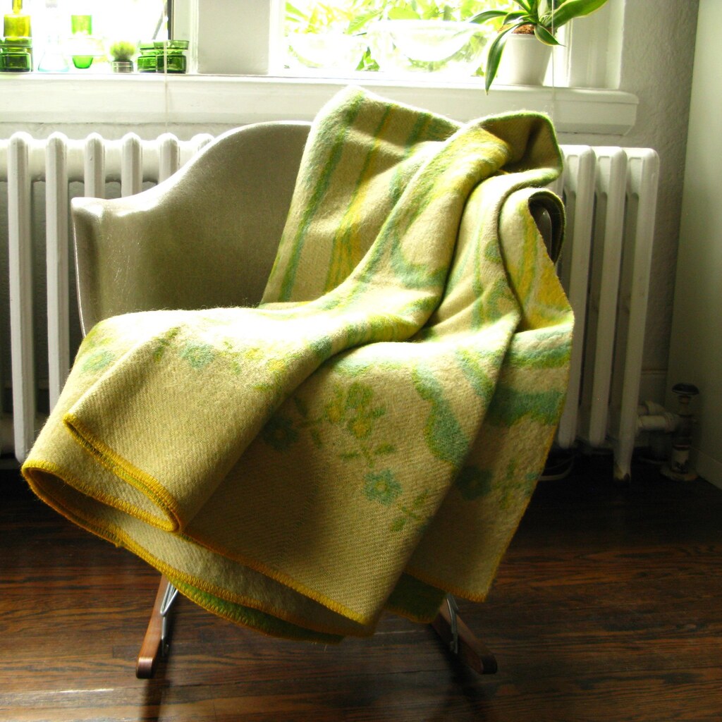 Photo of a blanket draped on a chair