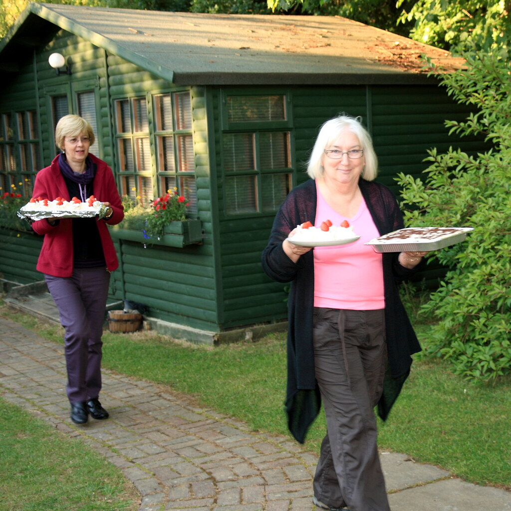 Photo of women bringing cakes