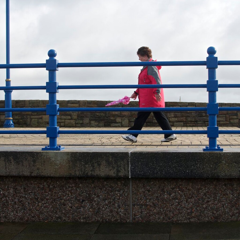 Photo of a woman going for a brisk walk