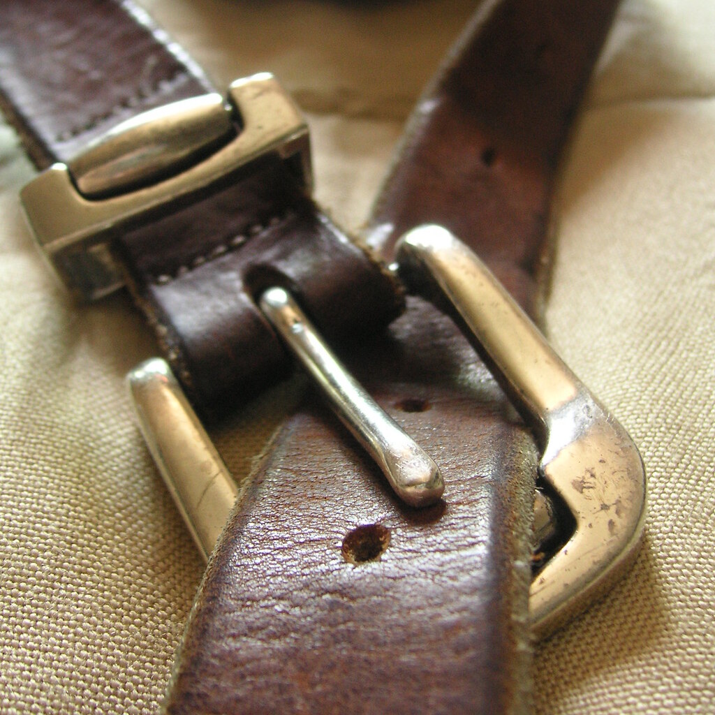 Photo of a buckle on a leather belt